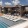 a swimming pool with lounge chairs and cabanas