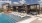 a swimming pool with lounge chairs and cabanas