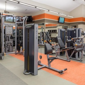State-of-the-art amenities a gym with exercise equipment