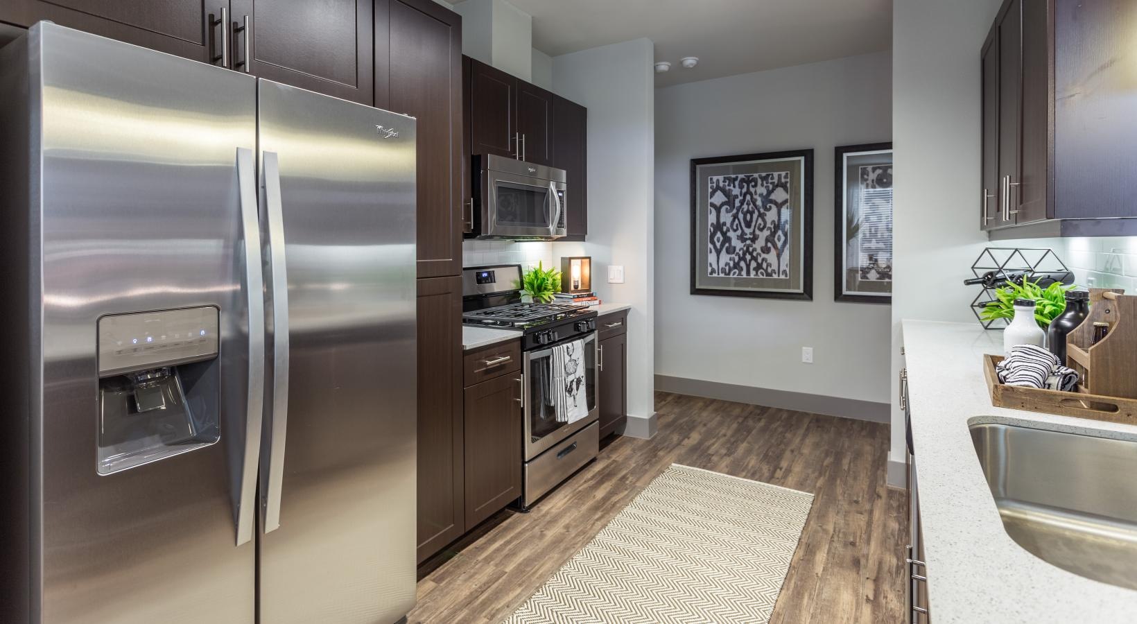 Beautiful kitchens with designer finishes track lighting brightens kitchen