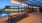 pergola covered patio deck next to pool
