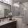 a bathroom with a glassed, walk-in shower