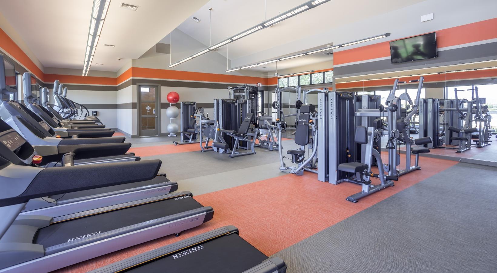Cutting-edge amenities at your fingertips a gym with treadmills