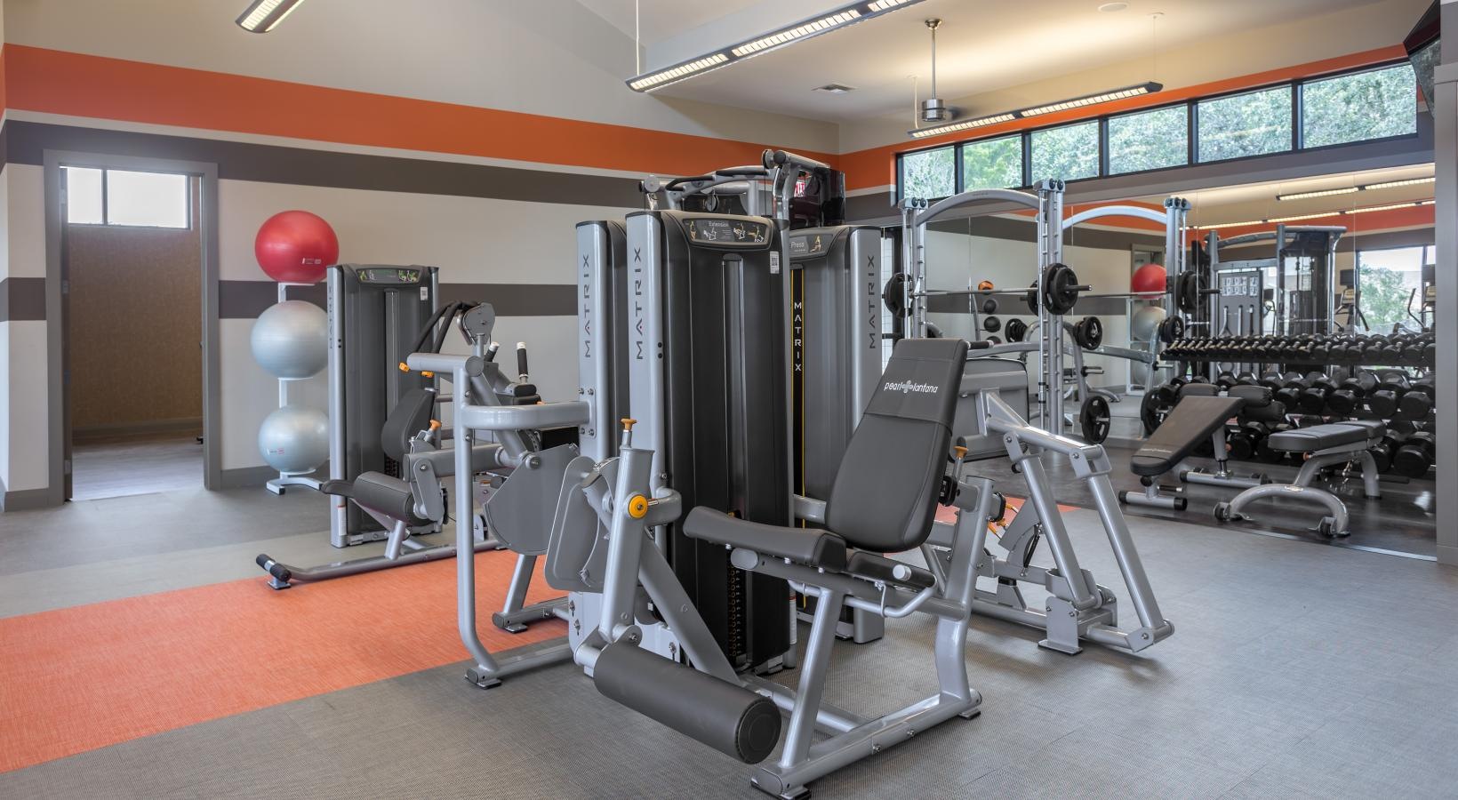 Quick access to state-of-the-art amenities variety of workout equipment in gym