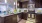 a kitchen with dark wood cabinets