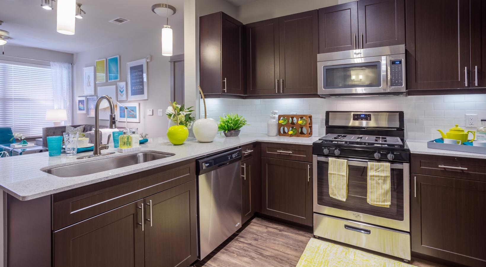 Spacious kitchens with thoughtful details a kitchen with dark wood cabinets