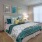 a bedroom with a bed and a chair