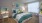 a bedroom with a bed and a chair