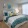a bedroom with a bed and a chair